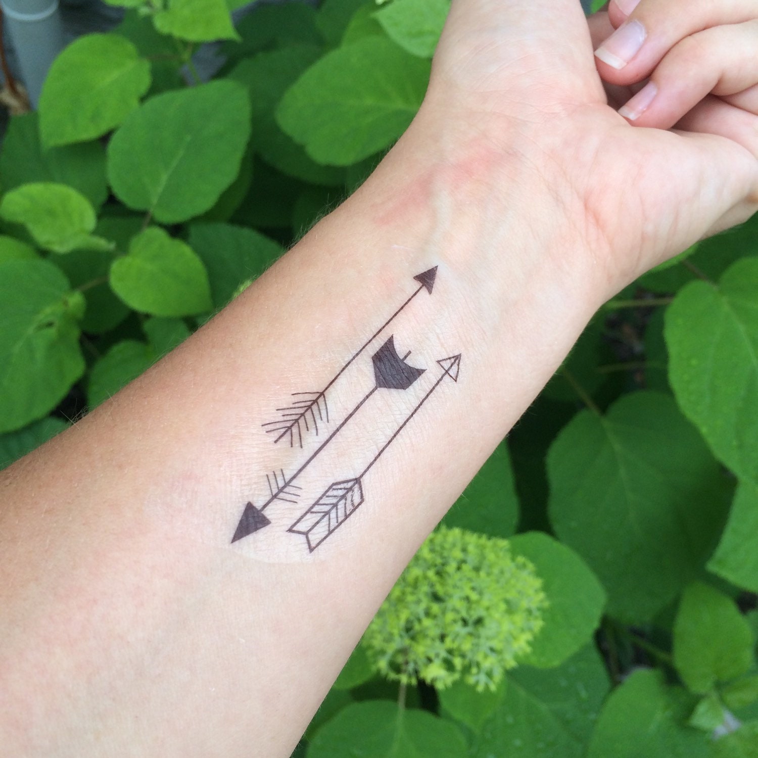 Handpoked small arrow tattoo on the forearm  Tattoogridnet