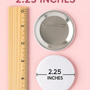 May include: A white button with a diameter of 2.25 inches. The button is shown next to a ruler and a US quarter for size comparison.
