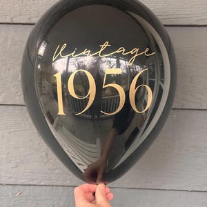 Black Latex Balloon that reads Vintage 1956 in gold text.  70th Birthday Balloon Decorations