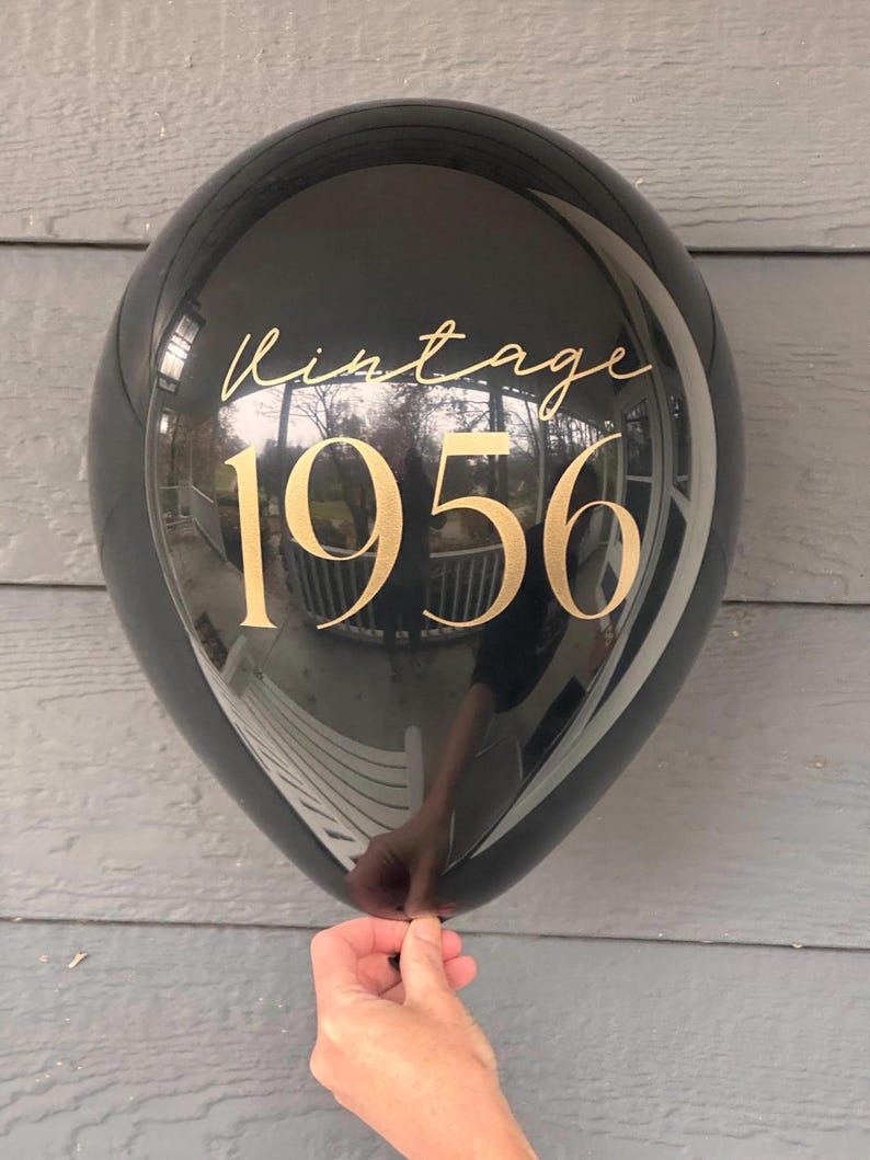 Black Latex Balloon that reads Vintage 1956 in gold text.  70th Birthday Balloon Decorations
