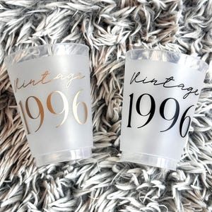Frosted 16 ounce plastic cups that read Vintage 1996 in a black and gold text.  30th Birthday Cups