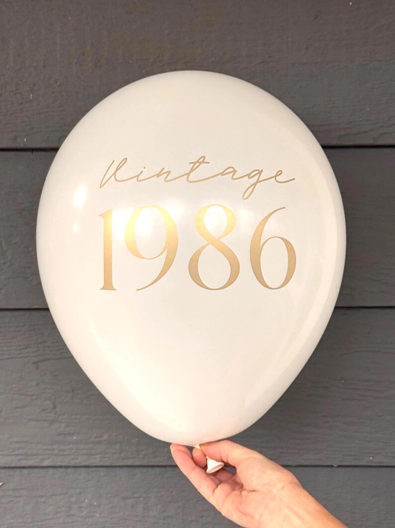 White latex Balloon that reads Vintage 1986 in gold text.  40th Birthday Party Decorations