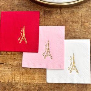 Cocktail napkin featuring “She Said Oui” text and Eiffel Tower illustration in foil stamping
