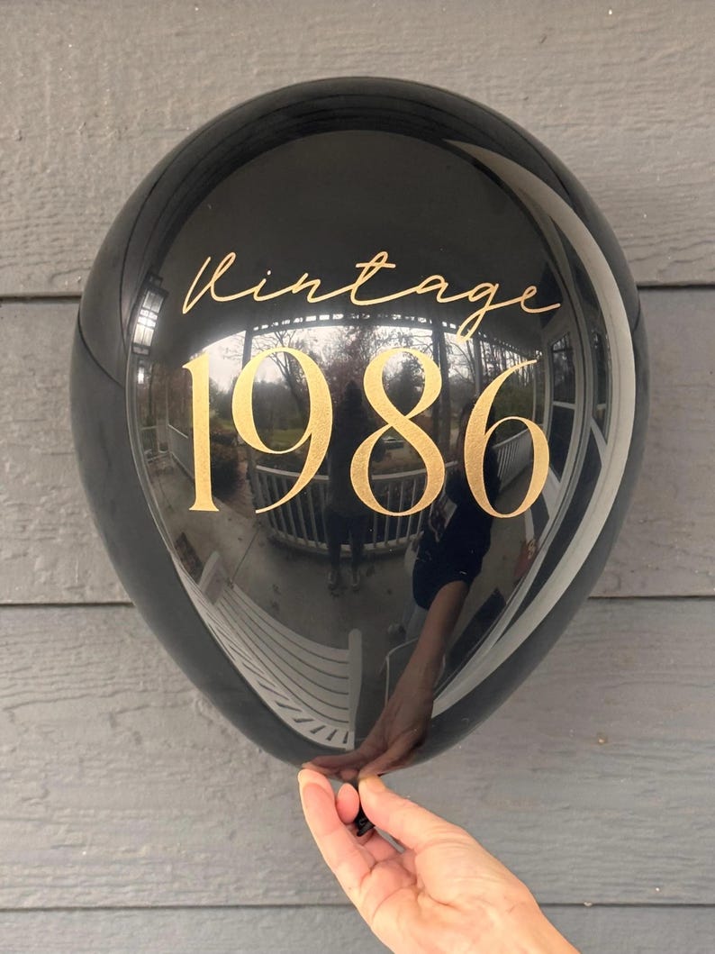 Black Latex Balloon that reads Vintage 1986 in gold text.  40th Birthday Balloon