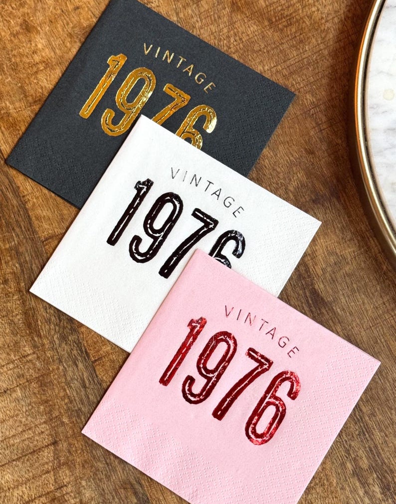 3 cocktail napkins that read Vintage 1976 in a bold font.  The drink napkins are stamped in various foil colors.  These napkins are for a 50th birthday, 50th anniversary or other milestone celebrations like a class reunion.