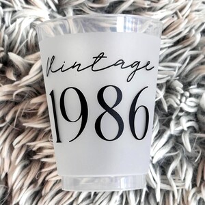 Frosted 16 ounce plastic reusable cup that reads Vintage 1986 in black font.  40th Birthday Party Favor.  These can also be used for a 40th Class Reunion, or a 40th Anniversary Cocktail Cup