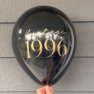 Black and gold 30th Birthday latex balloon that reads Vintage 1996 in a gold metallic font.  Perfect for a 30th Milestone, such as a Birthday, Anniversary or Class Reunion.