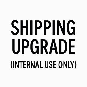 May include: Black and white text on a white background that reads "SHIPPING UPGRADE (INTERNAL USE ONLY)"