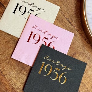 Foil stamped cocktail napkins reading “Vintage 1956” for milestone birthday celebration