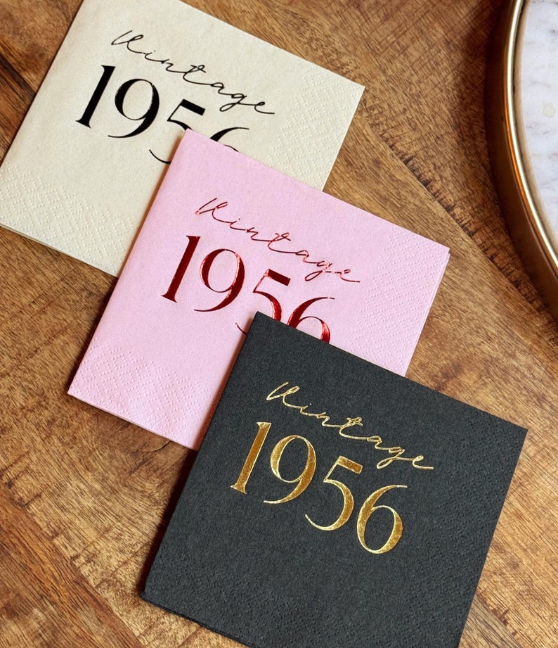 Foil stamped cocktail napkins reading “Vintage 1956” for milestone birthday celebration