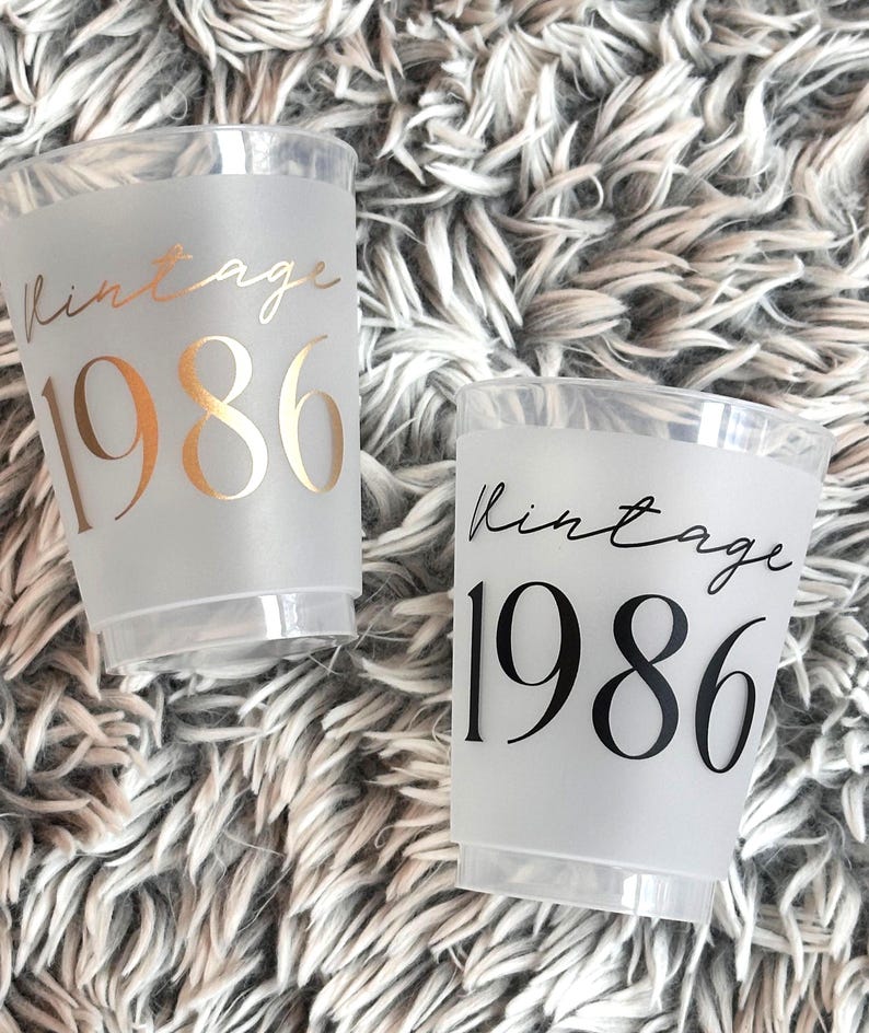 40th Birthday Frosted Plastic Cups that read Vintage 1986 in gold and black text.  40th Milestone Cups Black and Gold