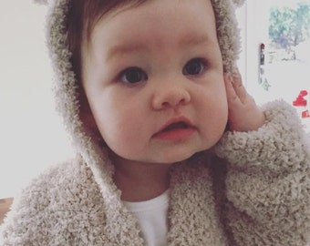 Snuggle Baby Hoody/ Sweater with bear ear hood available in three sizes.