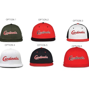 May include: Six baseball caps in various colors, including olive green, red, black, and white. Each cap features the word "Cardinals" in a script font. The caps are displayed against a white background.