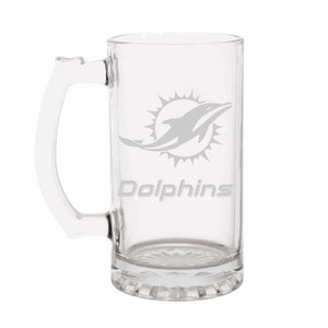 May include: A clear glass beer mug with a handle. The mug features the Miami Dolphins logo and the word "Dolphins" in a gray color. The mug is rectangular with a decorative base.