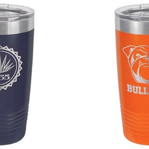 May include: Two insulated tumblers with silver rims and lids. One is navy blue with a silver design and the text "1955". The other is orange with a bulldog graphic and the word "BULLDOGS".