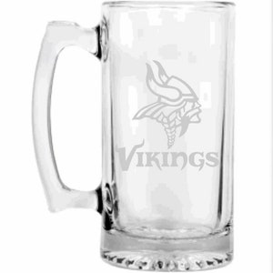 May include: Clear glass beer mug with a handle. The mug features the Minnesota Vikings logo and the word "Vikings" etched on the front. The design is in a light gray color.