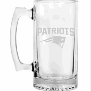 May include: Clear glass beer mug with a rectangular shape and a large handle. The word "PATRIOTS" is etched on the front, along with the team's logo. The mug is designed for holding beverages.