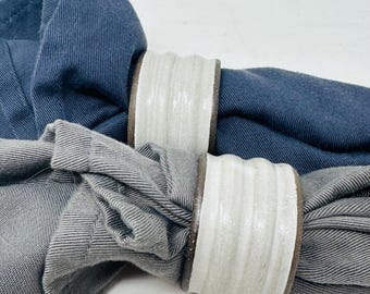 Carved ceramic  napkin rings by Raquel Muslin