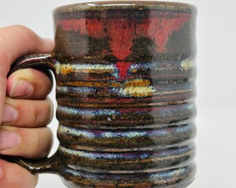 Reduction fired ripple mugs by Raquel Muslim