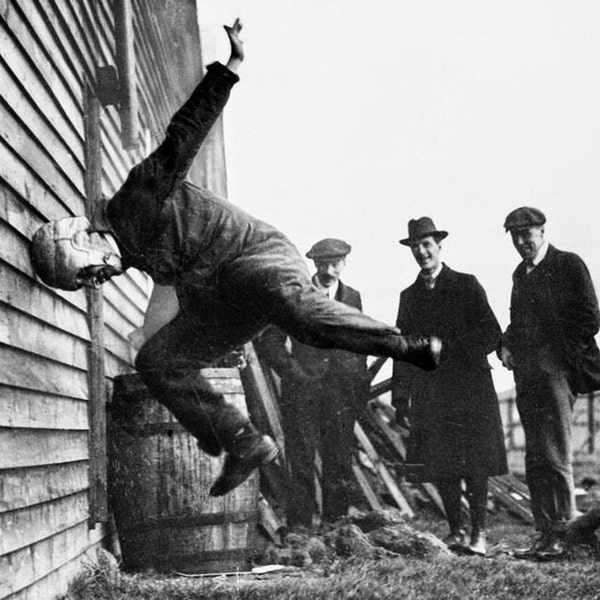 Vintage photo weird unusual photography print hitting wall testing helmet strange odd 1900s photograph frustration poster decor head first