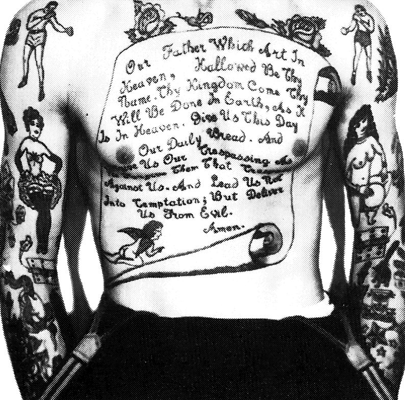 May include: A black and white photo of a person's torso with a large tattoo of the Lord's Prayer on their chest. The tattoo is surrounded by other smaller tattoos, including a woman holding a basket of flowers, a woman holding a ball, and a man boxing.