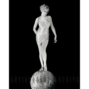 Retro glam art deco wall print, vintage photo black and white poster of 1920s woman standing on ball, unique antique fine art photography