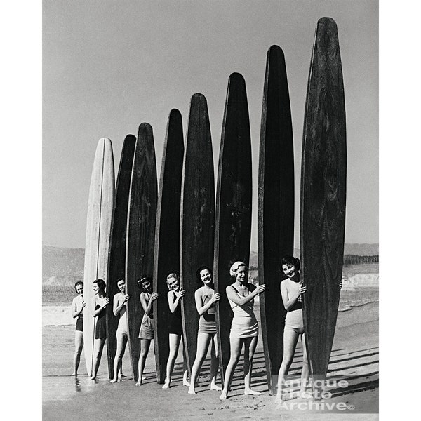 Vintage surfer photo surfing photography print poster gift for surfer on beach holding surfboards longboards beach house decor girls women