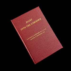 May include: A red leather-bound book with gold lettering on the cover. The title is "Diary Into The Unknown" by Eugene & Whitworth, Ph.D., LL.D and Ruth E. Whitworth, A.B.