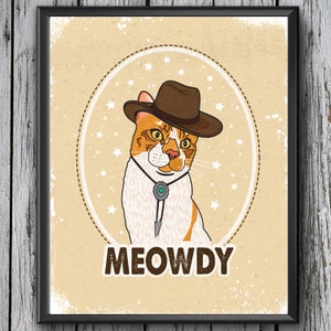 May include: A cartoon illustration of a cat wearing a brown cowboy hat with a turquoise stone on a bolo tie. The cat is surrounded by white stars on a tan background. The text "MEOWDY" is written below the cat.