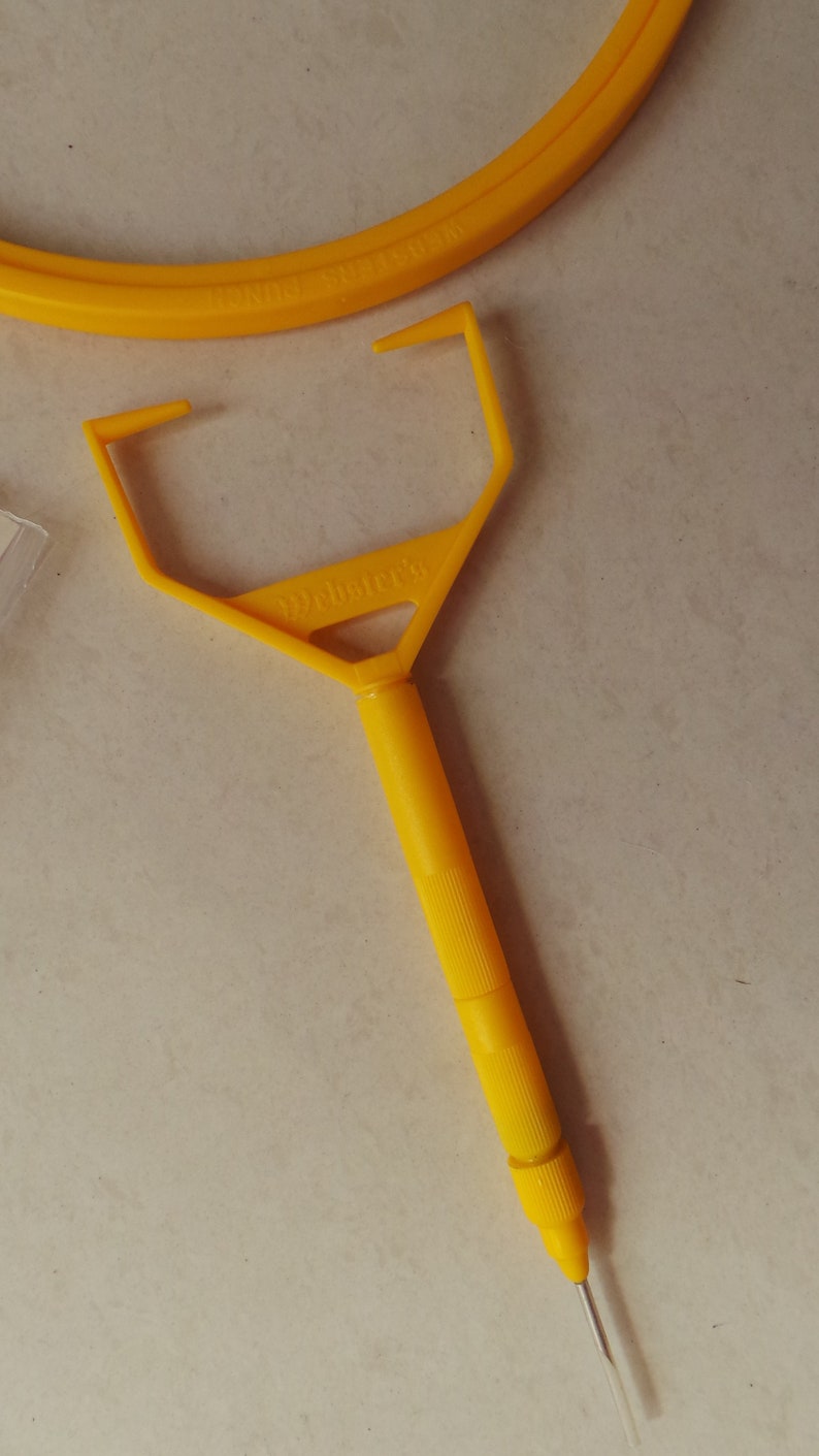 May include: A yellow plastic tool with a handle and a pointed end. The tool is labeled "Weldbetter's".