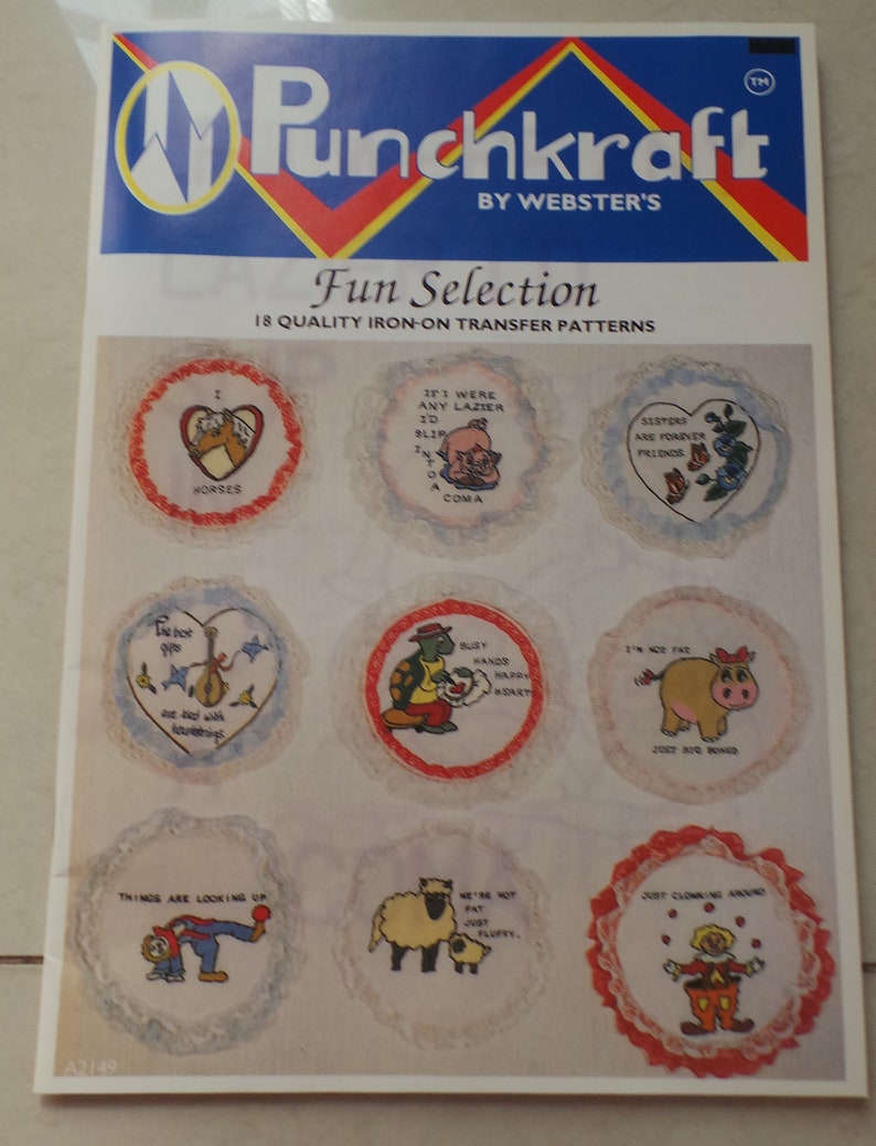 May include: A sheet of iron-on transfer patterns featuring various designs, including horses, a pig, a turtle, a sheep, and a clown. The patterns are surrounded by white lace and have a red, white, and blue color scheme. The sheet is labeled "Punchkraft Fun Selection 18 Quality Iron-On Transfer Patterns".