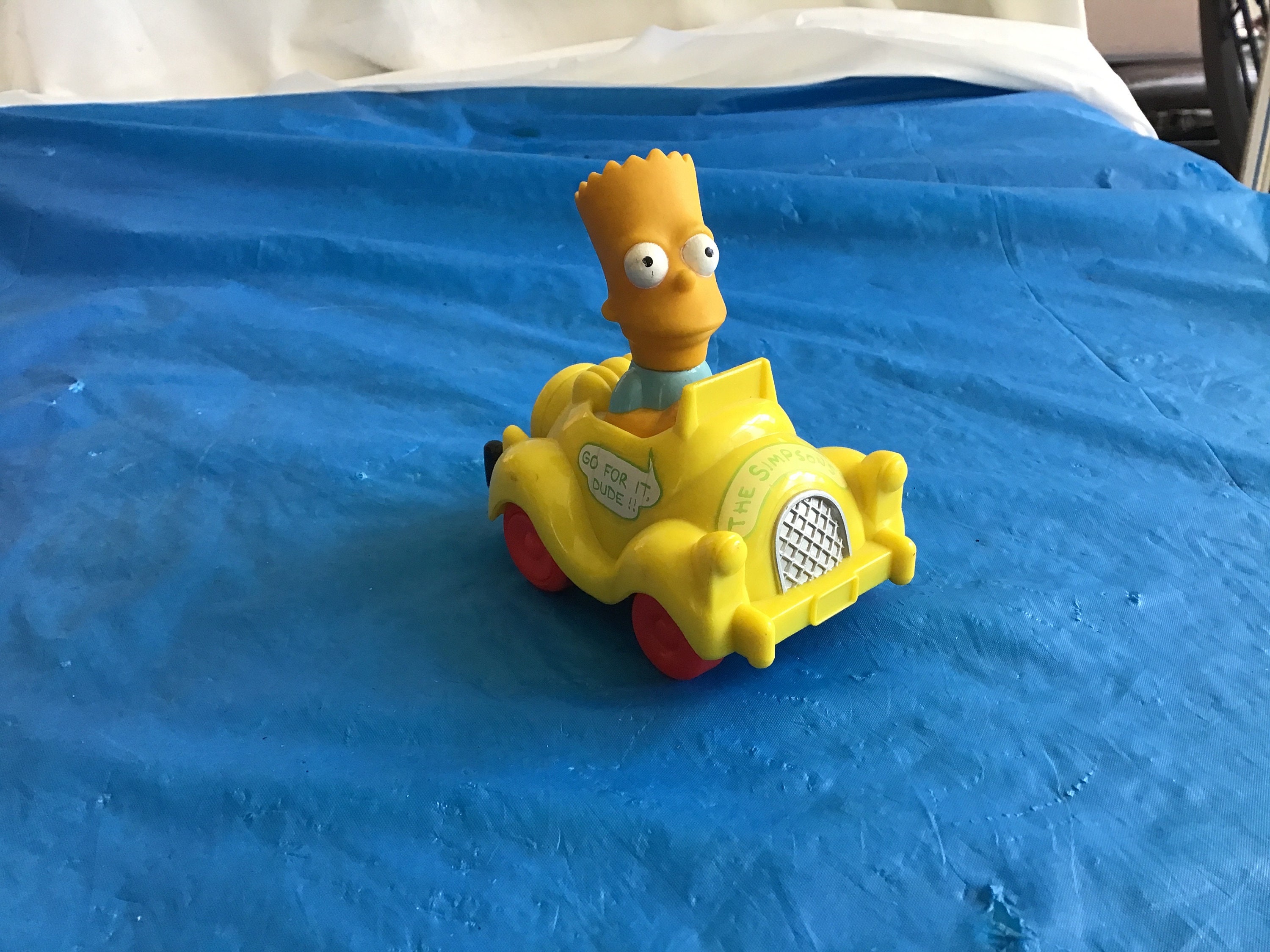 Bart Simpson Drives the Simpsons Family Car 3.75”T x 3.5”W x 2.75”D Push Toy.  Bart’s Head Rotates 360 Degrees