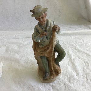 6”T Bisque Figurine - Dapper Old Gent, Hat on Head, Darns  a Fisherman’s Net