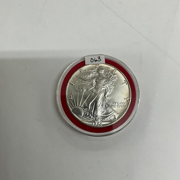 Original Vintage 1986 Uncirculated American Silver Eagle, Walking Liberty, One Ounce Fine Silver One Dollar Coin, In sealed Capsule, No. 063
