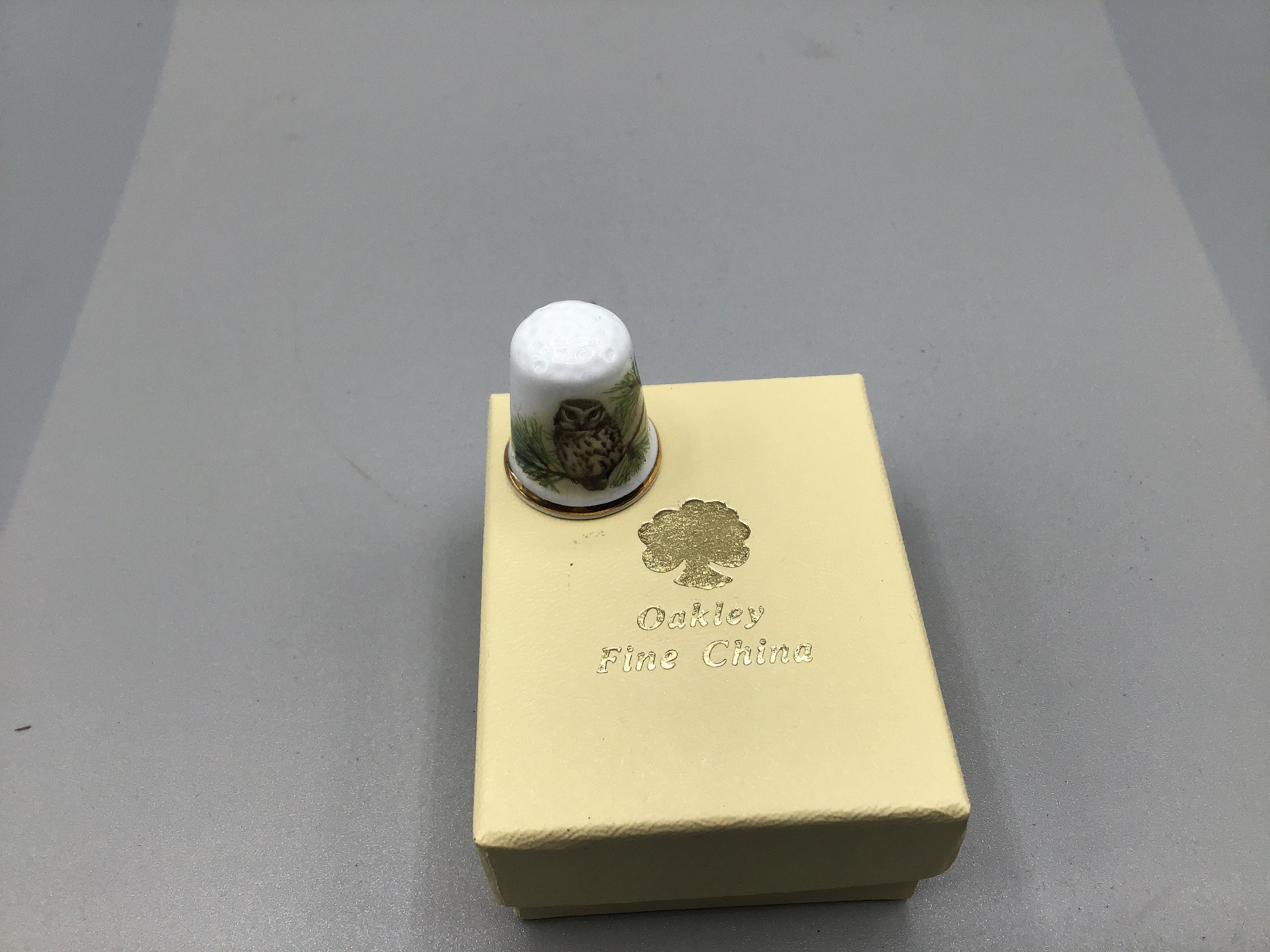 Oakley Fine China Thimble - Owl on Pine Tree Branch, Gold-tone Band at Bottom Edge - Made in England