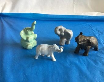 From a Collector’s Estate - Collection of 4 Elephants - 3 Ceramic, Colored Pale Gray, Dark Gray, & Green + 1 Die Cast Metal Elephant