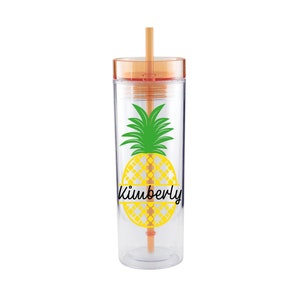 May include: A clear plastic tumbler with a straw, featuring a yellow pineapple with a green top and the name "Kimberly" written across the middle.