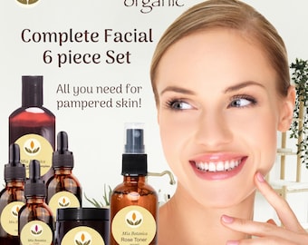 May include: A complete six-piece facial set from Mia Botanica, featuring organic products. The set includes bottles and jars with labels, and the text "All you need for pampered skin!" is displayed. The image also shows a woman smiling.