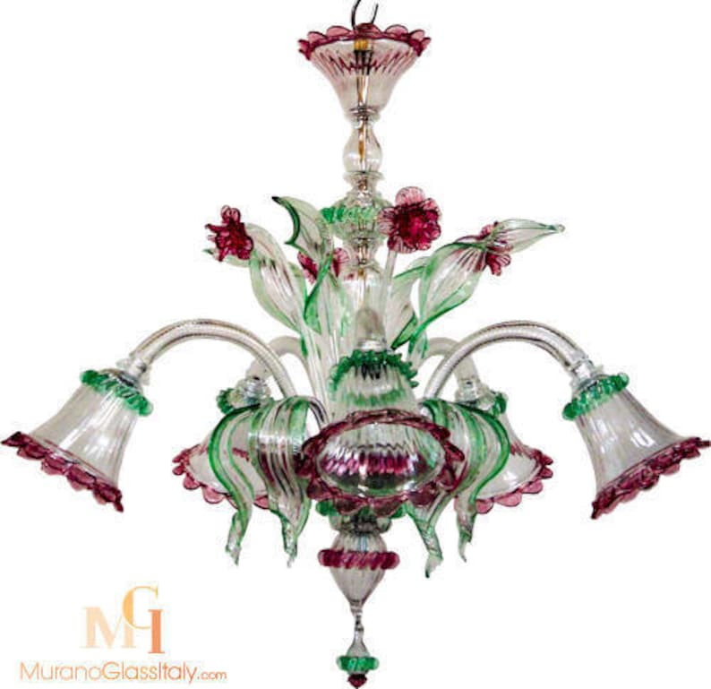 May include: A chandelier with a floral design, featuring pink and green glass flowers. The chandelier has six arms and is made of clear glass.