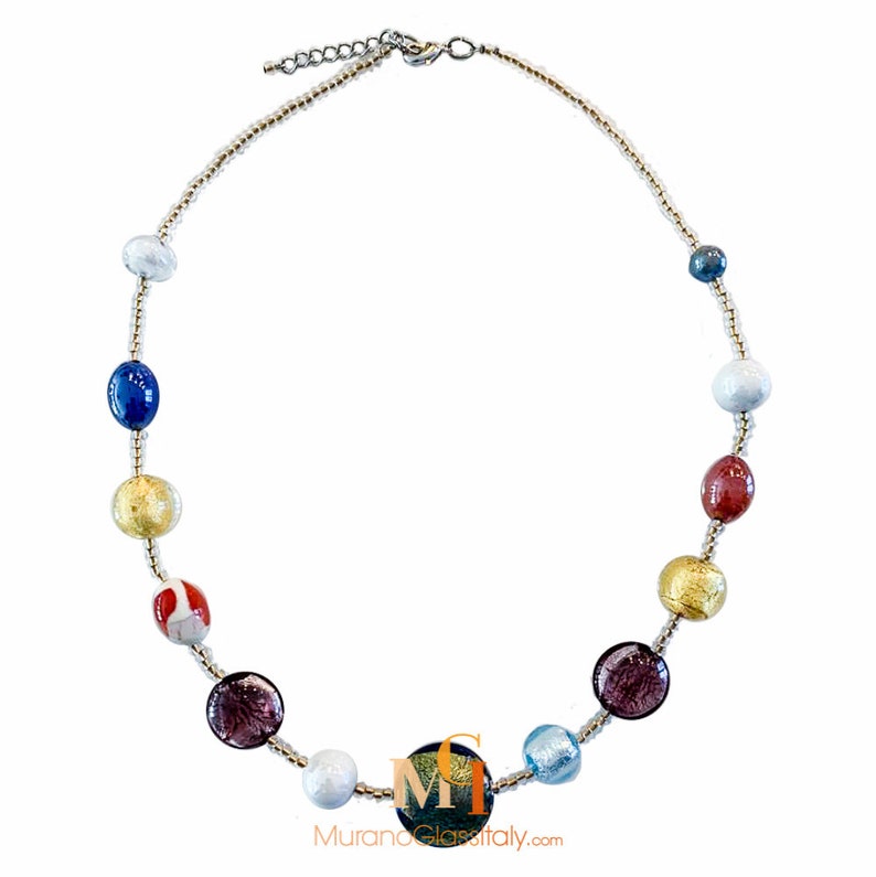 May include: A colorful glass bead necklace with gold accents. The necklace features a variety of colors, including blue, red, white, and gold. The beads are all different shapes and sizes, and they are strung on a silver chain.
