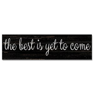 May include: Black wooden sign with white text that reads "the best is yet to come".
