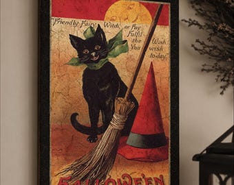 May include: A framed rectangular print featuring a black cat with a green bow, a broomstick, and a red pointed hat against a textured gold and red background. The text reads: Friendly Fairy, Witch, or Fay Fulfil the You wish wish to day, and HALLOWEEN.