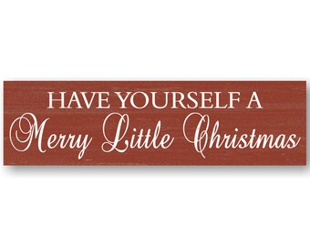 May include: Red wooden sign with white text that reads "Have Yourself a Merry Little Christmas".