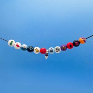 Ultimate Percy Jackson Camp Half-Blood Necklace- 12-Bead Collector’s Necklace- With Annabeth&#39;s Ring- Hand-Painted Beads for Cosplay, & Gifts
