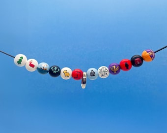 Ultimate Percy Jackson Camp Half-Blood Necklace- 12-Bead Collector’s Necklace- With Annabeth's Ring- Hand-Painted Beads for Cosplay, & Gifts