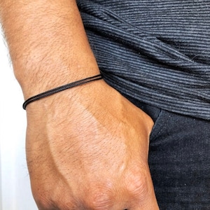 Minimalist adjustable nylon cord bracelet with sliding knot closure