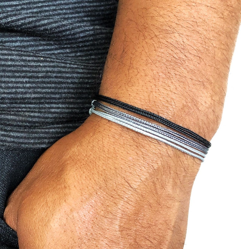 Waterproof adjustable cord bracelet stack in multiple colors on wrist