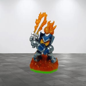 May include: A toy action figure of a warrior with a fiery head and orange flames for a sword. The figure is clad in blue and silver armor and stands on a base of orange flames with a green border.