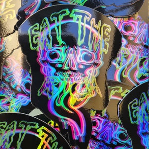 Black holographic eat the rich sticker