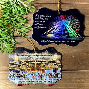 May include: Two Christmas ornaments featuring a Ferris wheel and a carousel. Both ornaments have a black background with a gold trim and the text "The rides may end but, the memories will live on forever." and "Gillian's Wonderland Pier Oct. 2024".